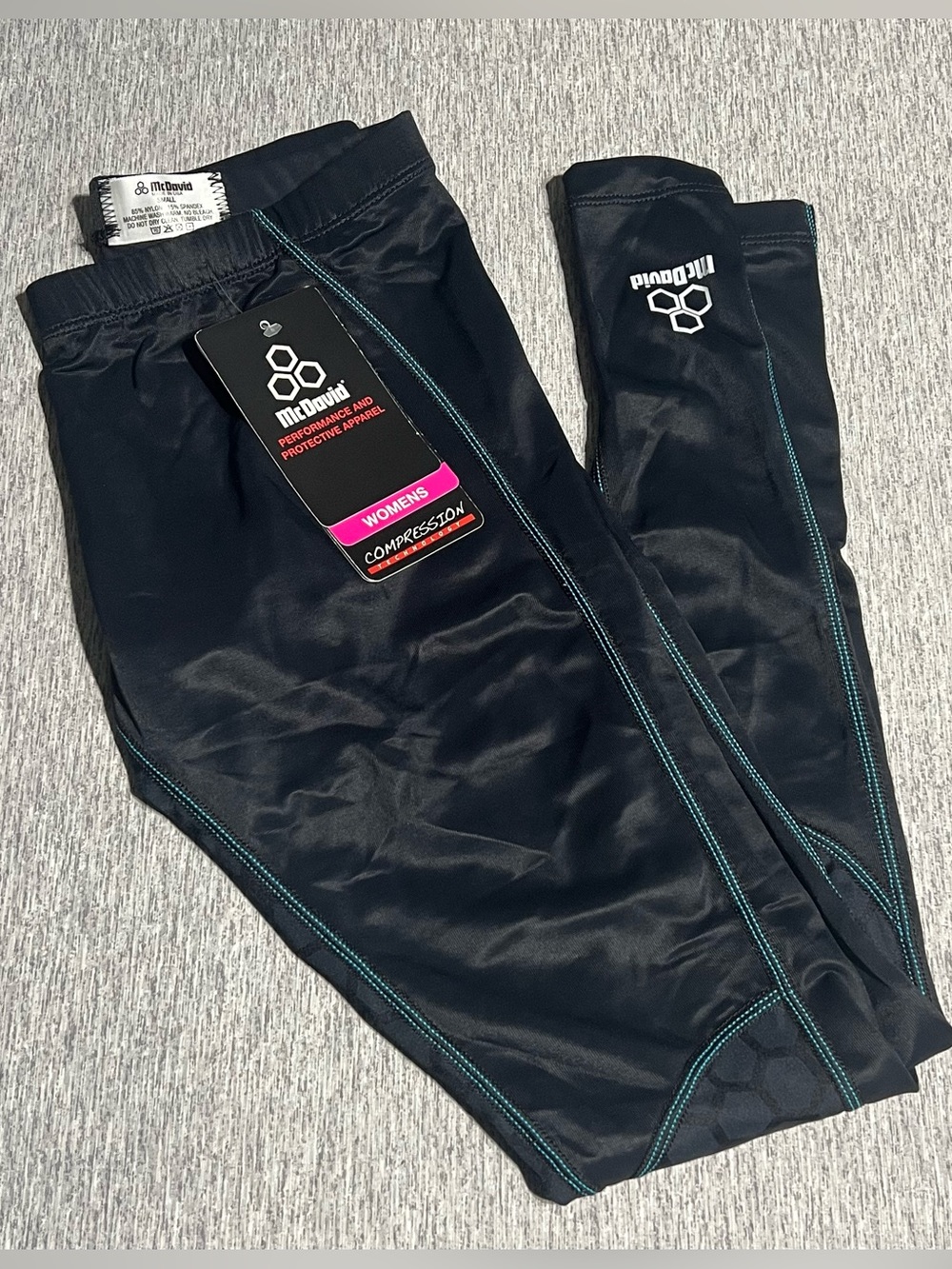 McDavid Women’s Black Recovery Compression Pants with Teal Stitching